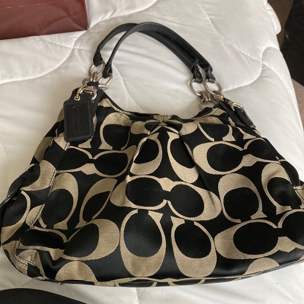 Three compartment coach purse.